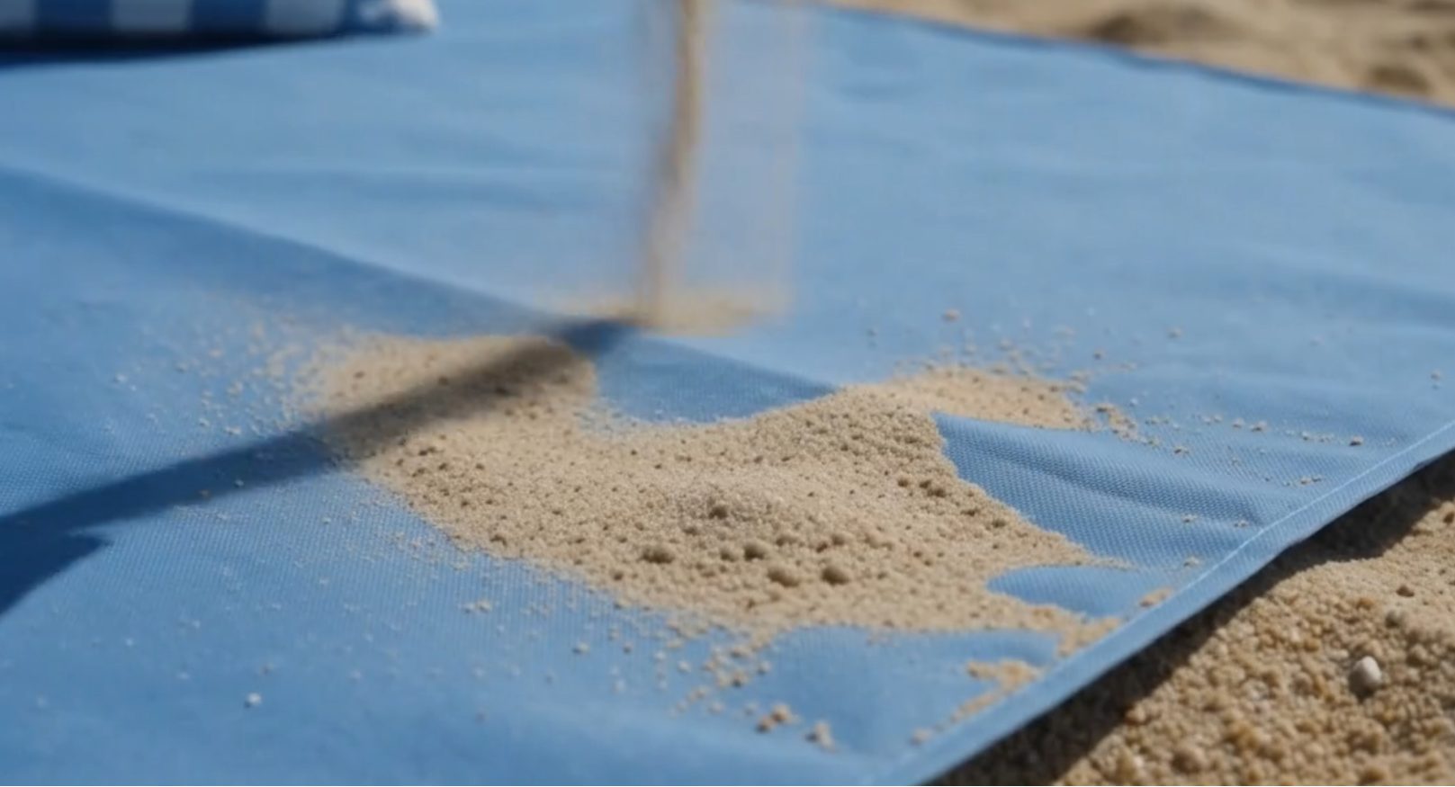 Sand piled on top of the Breeze BeachBed fabric